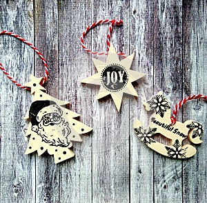 Three beautiful christmas toys on wooden background