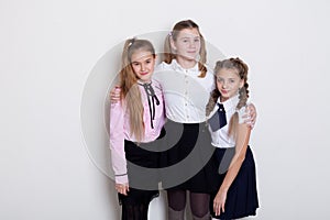 Three beautiful girls at the school board in class in class