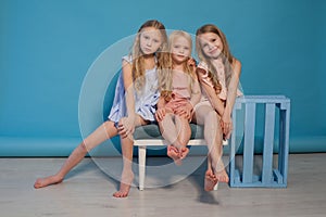 Three beautiful little girls dresses fashion portrait sisters photo