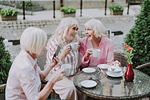 Three beautiful older women having fun together