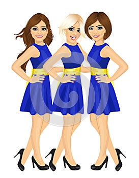 Three beautiful professional fair hostess women standing with blue uniform