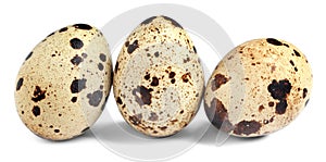 Three beautiful quail eggs on white background