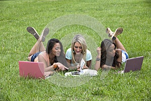 Three beautiful woman study in the park