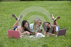 Three beautiful woman study in the park