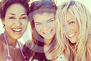 Three Beautiful Young Women Friends Laughing At The Beach