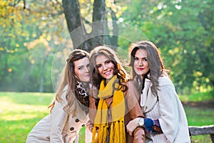 Three beautiful young women in the park
