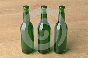 Three beer bottles 500ml mock up on wooden background