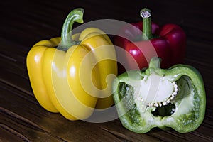 Three Bell Peppers with one Sliced