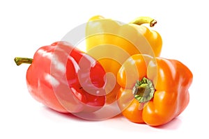 Three bell peppers on white