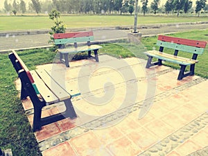 Three benches in lawn of park