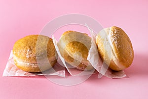 Three Berliner Doughnuts European Donuts Tradicional Bakery for Fasching Carneval Time Vertical Pink Background