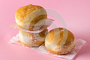 Three Berliner Doughnuts European Donuts Tradicional Bakery for Fasching Carneval Time Vertical Pink Background