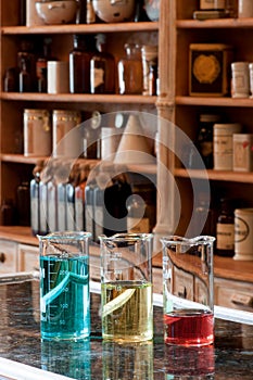 Three berzelius glasses with colored liquid