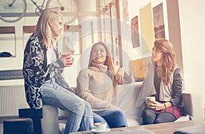 Three best friends. Young women having conversation.