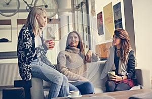 Three best friends. Young women having conversation.