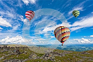 Three big multi-colored balloons