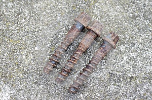 Three big old rusty screws