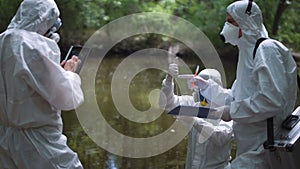 Three bio technicians testing for pollutants