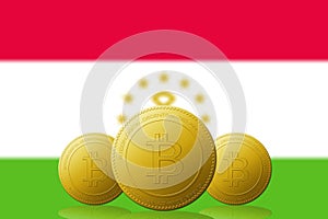 Three Bitcoins cryptocurrency with Tajikistan flag on background