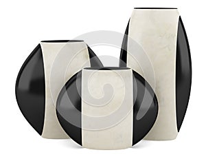 Three black and beige ceramic vases isolated on white