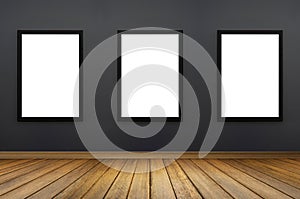 Three Black frame hanging on a grey wall.white isolate.perspective wooden floor.for advertiser.graphic design