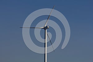 Three-bladed wind turbine on the banks of the River Mersey Liverpool Merseyside September 2011