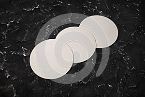 Three blank beer coasters
