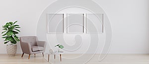 Three blank poster frame in bright room with white wall and moderm furniture in scandinavian style  for mockup.