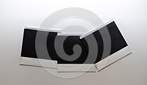 Three blank retro photo frames on white background.