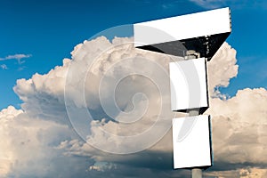 Three blank white billboard against blue sky with white clouds - mock up