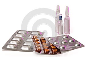 Listers with pills and some ampoules isolated on white