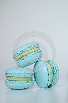 Three  blue blueberry french macaroons with dor blue cheese cream inside