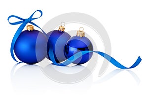 Three blue Christmas baubles on white background