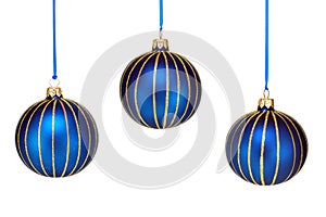 Three Blue and Gold Christmas Ornaments on White