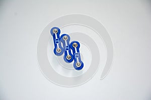 Three blue plastic electronic connection blocks, metal rivets, labeled as 