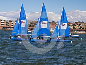 Three Blue Sailing Boats