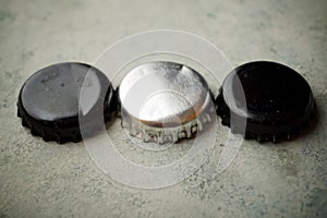 Three bottle caps