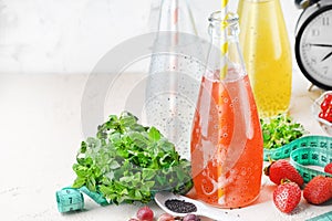 Three bottles of drinks with basil seeds. Useful juices for diet or nutrition. Immune cocktail. Copy space