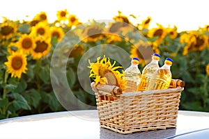 Three bottles of sunflower oil in a wicker basket