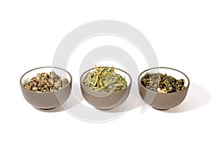 Three bowls of herbal tea.