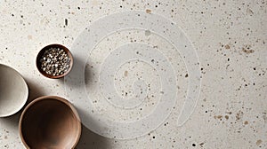 Three Bowls on a Speckled White Surface