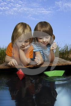 Three boy play in puddle