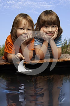 Three boy play in puddle