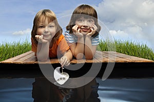 Three boy play in puddle