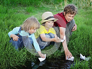 Three boy play in stream