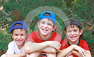 Three Boys in Baseball Hats