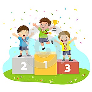 Three boys with medals standing on sport winners pedestal and holding a trophy