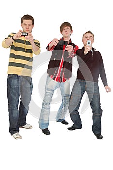 Three boys shooting something on mobile phone