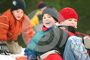 Three Boys Sledding
