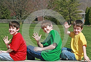 Three Boys Waving photo